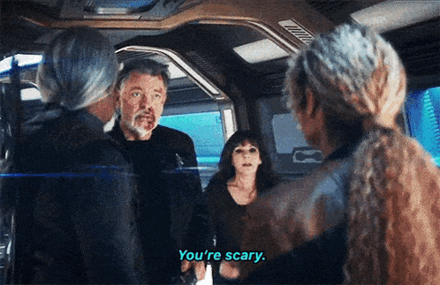 a group of people are standing around talking and one of them says you 're scary