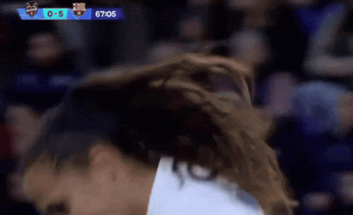 a close up of a person 's head with a score of 0-5 behind them