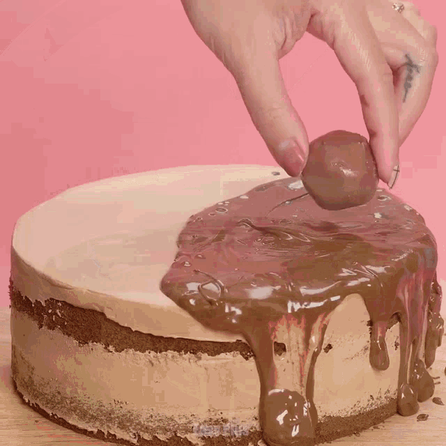a cake with chocolate and strawberries on top of it