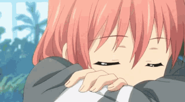 a close up of a pink haired anime girl with her eyes closed .