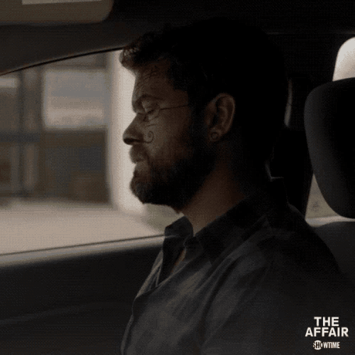 a man is sitting in a car with the affair showtime written on the bottom