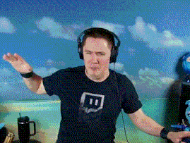 a man wearing headphones and a black t-shirt with a twitch logo on it .