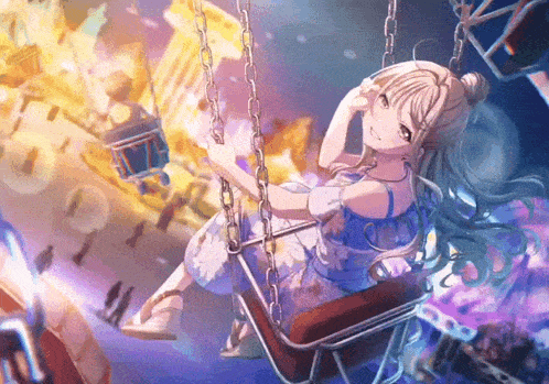 a girl in a blue dress is sitting on a swing