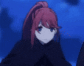 a girl with red hair and blue eyes is wearing a black cape and ponytail .