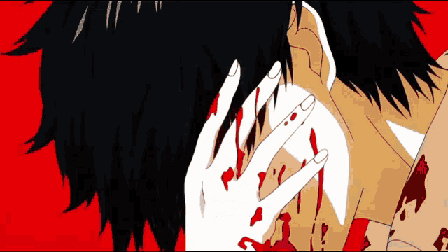 a bloody hand is covering a man 's face