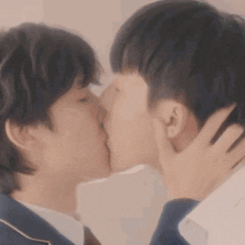 a man and a woman are kissing each other .