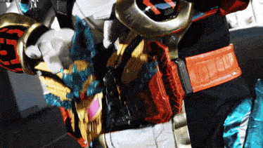 a close up of a person wearing a costume with a belt that has the letter e on it