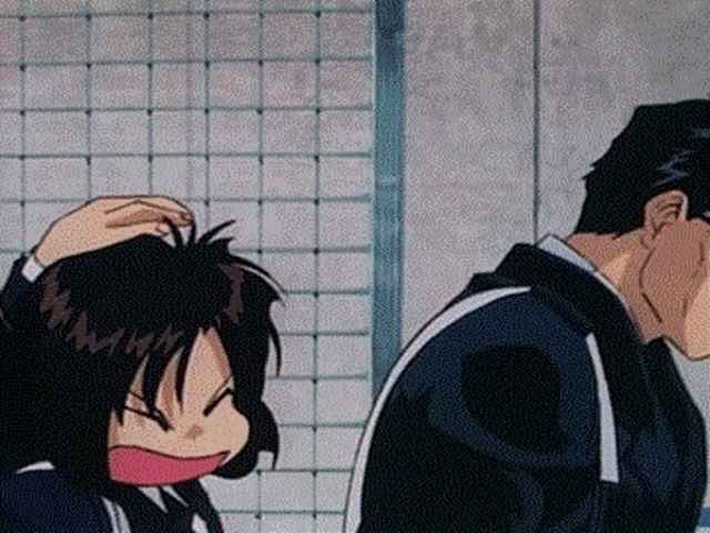 a man and a girl are standing next to each other in a room .