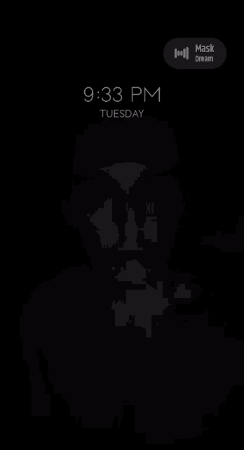 a phone screen shows the time as 9:33 pm