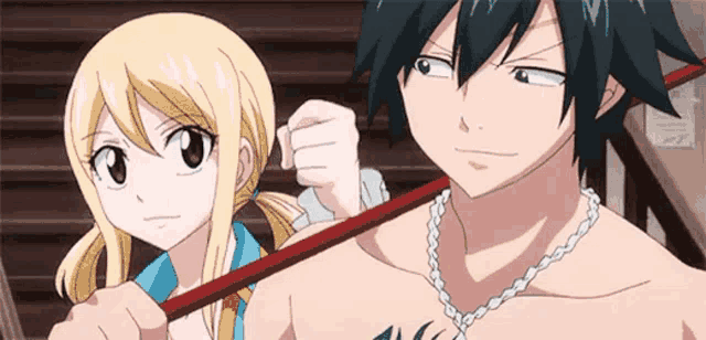 a man and a woman are standing next to each other holding a stick