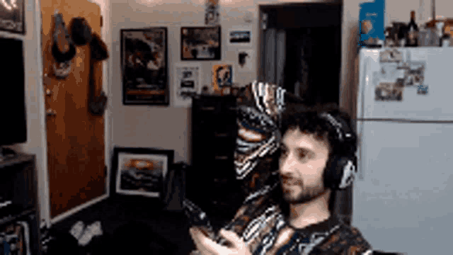 a man wearing headphones in a living room