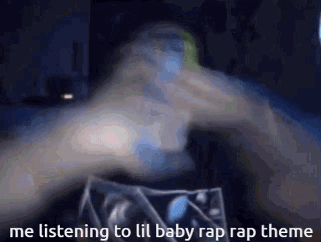 a blurry image of a person 's hands with the caption " me listening to lil baby rap rap theme "