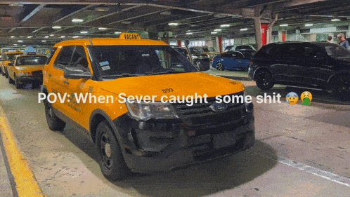 a yellow taxi cab with a vacant sign on top of it