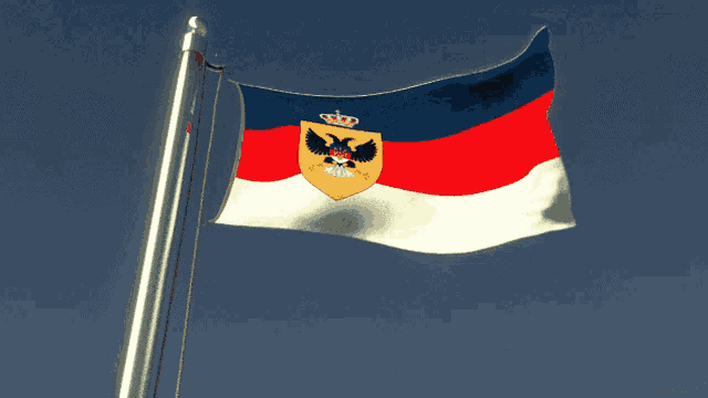 a red white and blue flag with an eagle and a crown