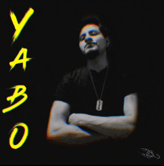 a man stands with his arms crossed in front of a sign that says ya bo