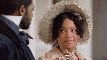 a man and a woman are looking at each other