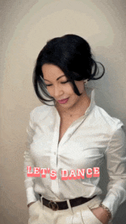 a woman in a white shirt with the words let 's dance written on it