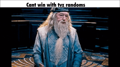 a man with a beard and a crown is standing in a room with a caption that says cant win with tvz randoms