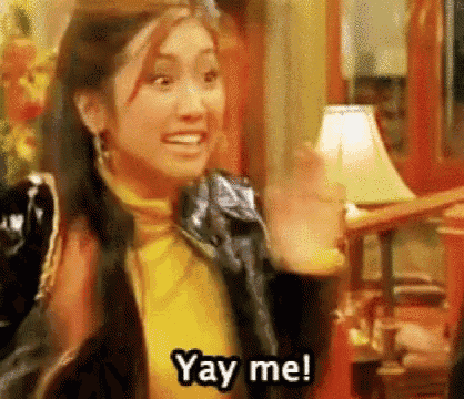 a woman is waving her hand and saying `` yay me ! ''