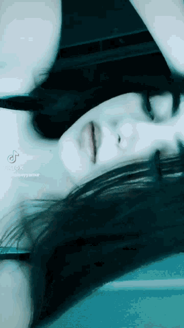 a woman 's face is shown in a tik tok video