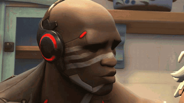 a bald man wearing headphones with a red circle around the ear
