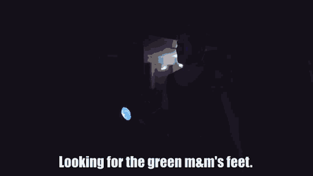 looking for the green m & m 's feet written on a dark background