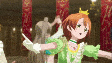a girl in a green dress with a crown on her head is dancing