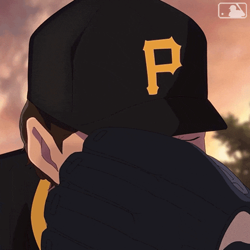 a man wearing a pittsburgh pirates hat covering his face