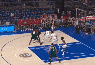 a basketball game is being played on a court that has the number 10 on it