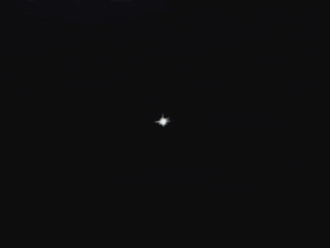 a white star with a black background is a cartoon explosion