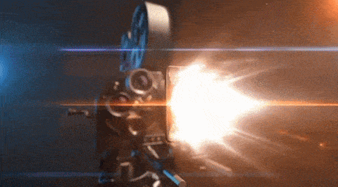 a movie camera is shooting a bright light behind it