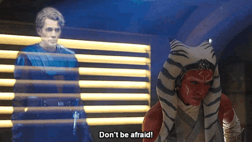 a woman in a tiger costume says " don 't be afraid " in front of a man