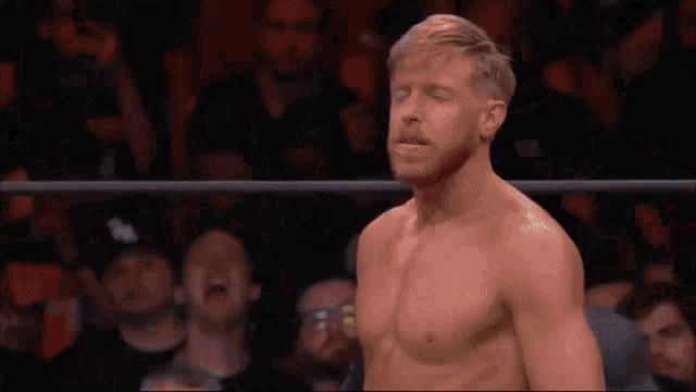 a man in a wrestling ring is wearing a shirt that says city on it