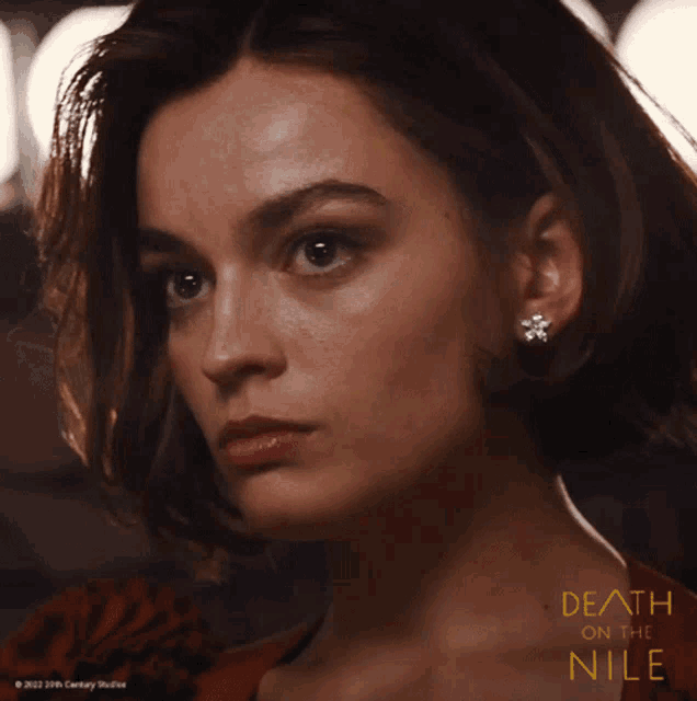 a close up of a woman 's face with the words death on the nile