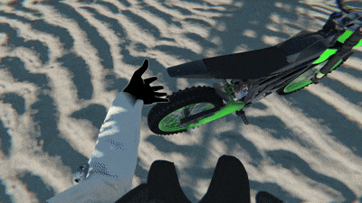 a person giving a thumbs up while riding a dirt bike
