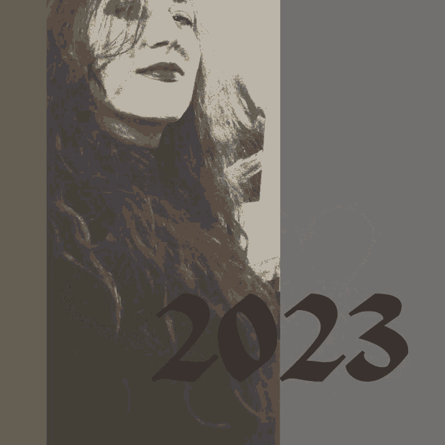 a poster with a woman 's face and the number 2023