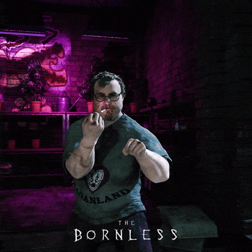 a man wearing a shirt that says the bornless on it