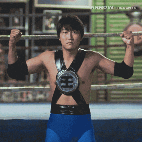 a man in a boxing ring with arrow presents on the bottom right