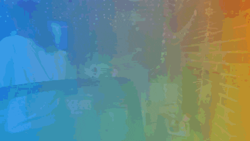 a rainbow colored background with a person in the middle