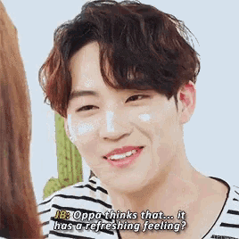 a close up of a person 's face with the words jb oppa thinks that it has a refreshing feeling .