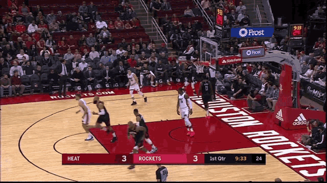 a basketball game between the heat and the rockets is being played