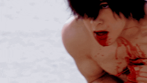 a man with blood coming out of his mouth has a hole in his chest