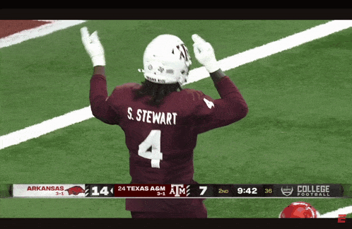 a football player wearing a maroon jersey with the number 4 on the back