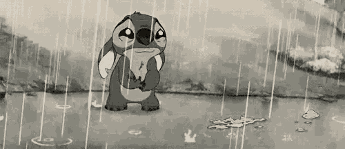 a black and white cartoon of stitch standing in the rain .