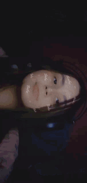 a close up of a person 's face with hearts and the word babe on it