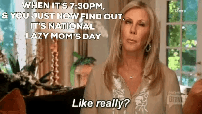 a woman is sitting in a living room talking about national lazy mom 's day