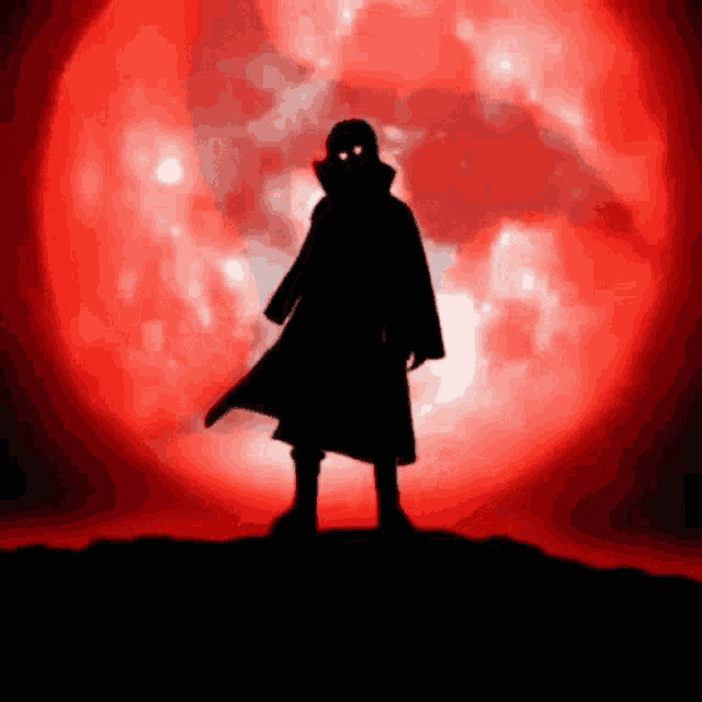 a silhouette of a person standing in front of a red background