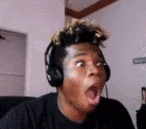 a man wearing headphones is making a surprised face while looking at the camera .