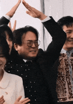 a group of people giving each other high fives