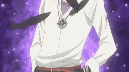 a man wearing a white shirt and a black feather necklace is standing with his hands in his pockets .